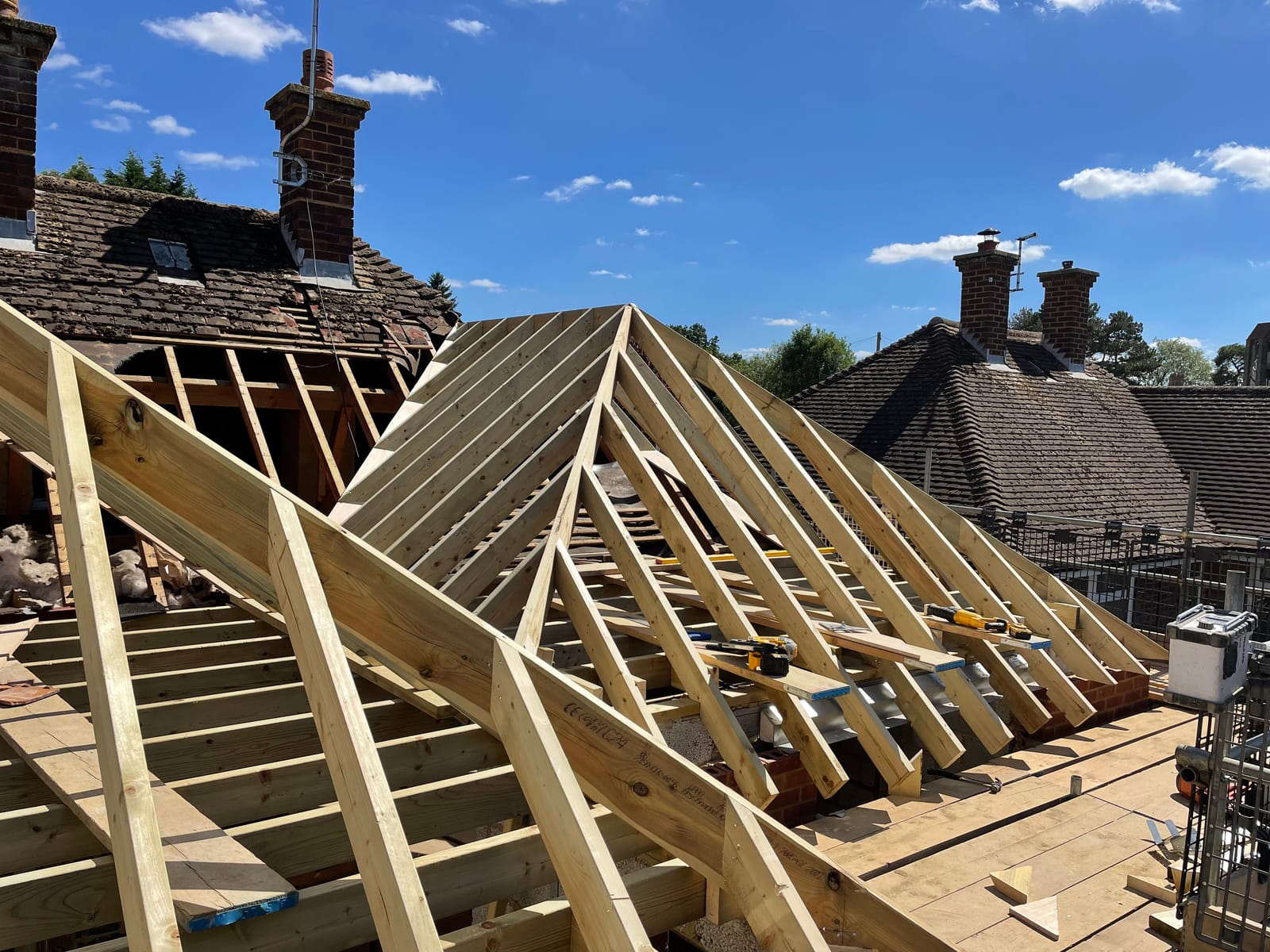 New hipped roof timbers framed up on a house