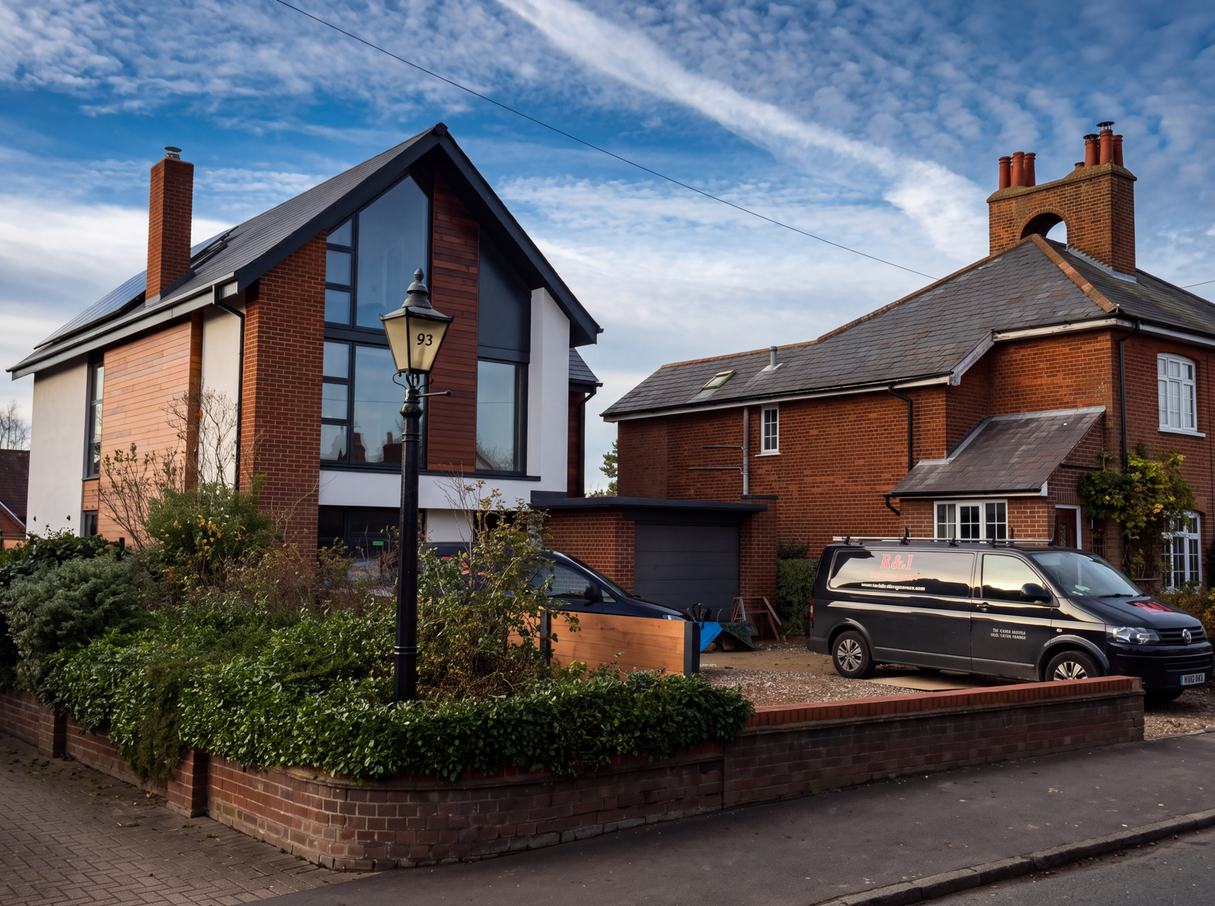 An R&J Building Services van outside a finished home in Bedfordshire